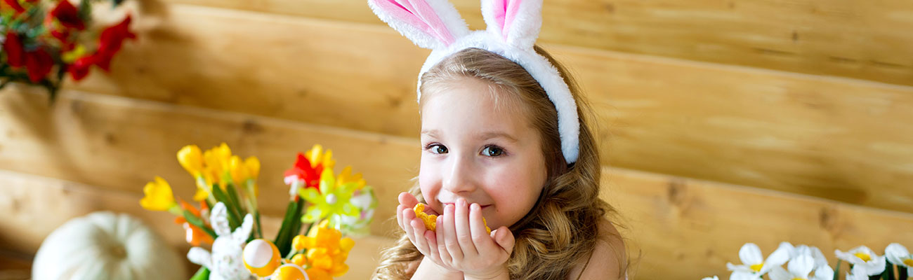 Little girl wearing bunny ears for easter