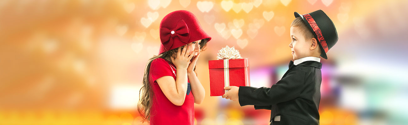Children exchanging a Valentine's day gift box
